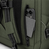 Close-up of an olive green backpack with a side zipper open, holding a smartphone and a gray card, showing the fabric texture, mesh panel, and white contrast stitching.