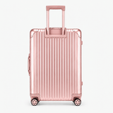 A metallic pink hard-shell suitcase with vertical grooves, a telescoping handle extended, and four spinner wheels, shown against a plain light gray background.